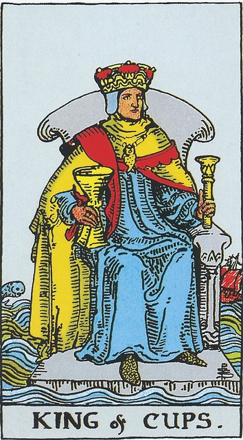 A crowned king sits on a throne holding in his left hand the scepter of office and in his right a chalice.  Around his neck is a golden chain bearing a fish.  His throne is stone and vaguely mimics a seashell, and is just above a turbulent sea, but the water does not touch him.  His robes are blue, with a yellow cloak with red trim over the top.  In the distance is a ship with red sails, apparently being tossed around by the stormy seas and on the other side of him in the distance is a leaping dolphin.  

