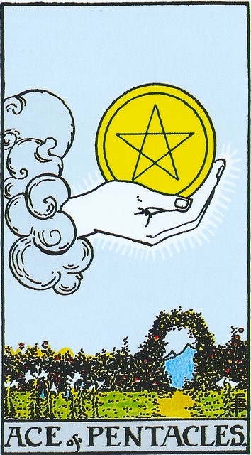 The Ace of Pentacles:  In the middle of a clear blue sky, a large hand surrounded by rays of light emerges from a puffy cloud.  Cradled in the palm of the hand is a large coin, or disk, bearing a five-pointed star.  There is a straight path through what appears to be a garden of white lilies leading to a tall hedge of roses in which an arched opening is cut.  In the distance, though the arch, we see a mountain peak.  